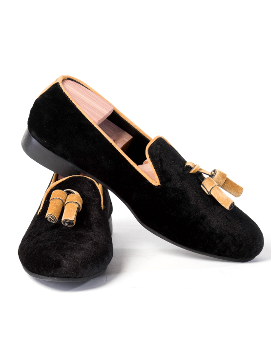 black loafers with gold tassels